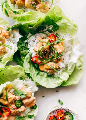 Bang Bang Chicken Lettuce Wraps - a homemade lettuce wrap stuffed with jasmine rice, sautéed chicken and tons of bang bang sauce! #bangbangchicken #bangbangsauce #bangbanglettucewraps #chickenlettucewraps | Littlespicejar.com