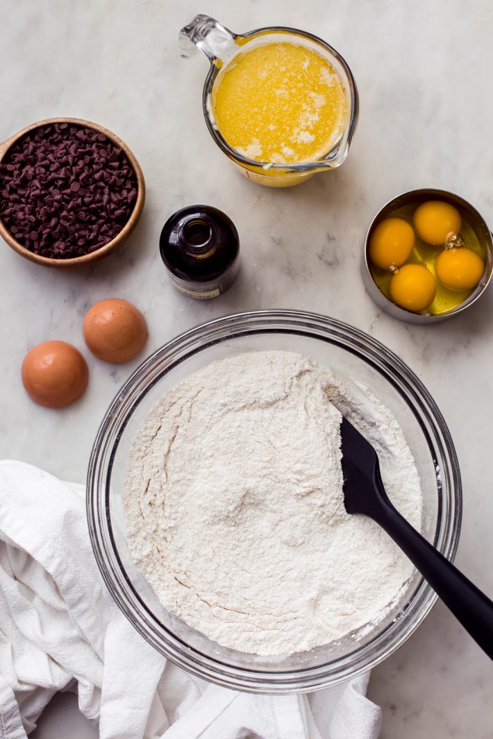 all the ingredients you need to make a vanilla bundt cake with chocolate chips